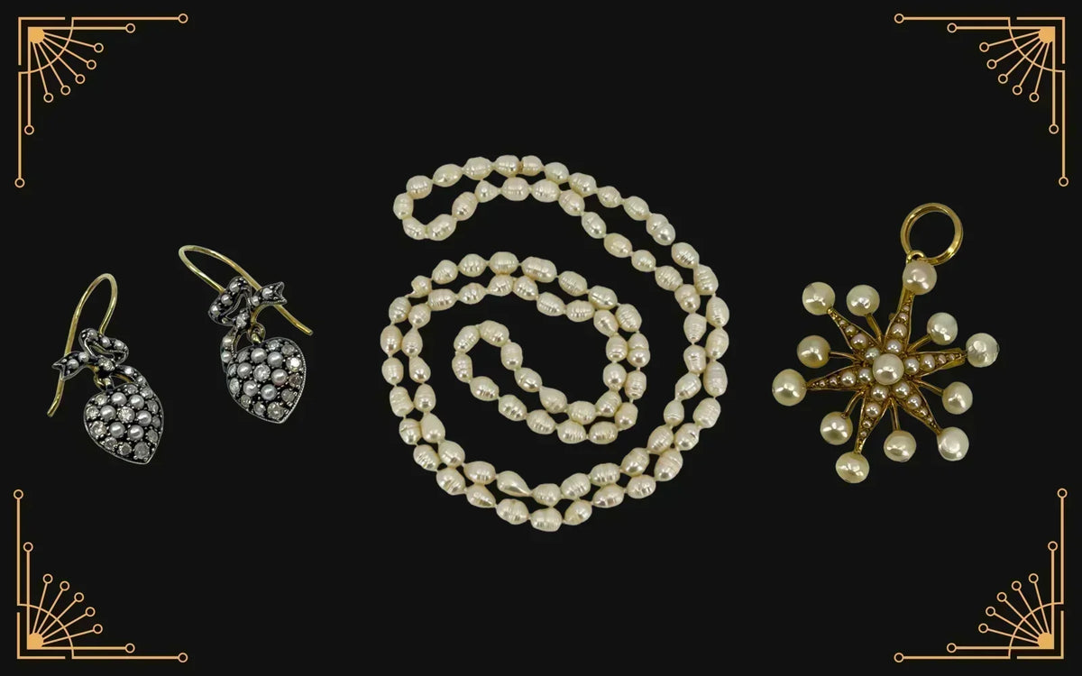 Pearl necklace with pearl drop earrings and a pearl star pendant on a black Art Deco background.
