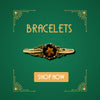 Gold vintage bracelet with ornate detailing and central garnet stone on green Art Deco background