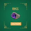 Platinum vintage ring with large faceted purple amethyst and pavé setting on green Art Deco background