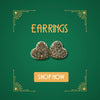 Vintage heart shaped stud earrings with pavé stones on green Art Deco background