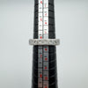 A 0.90ct Moissanite princess-cut channel set band in sterling silver 925, displayed on a ring mandrel, showing size N-O