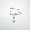 Full necklace with pearl drop pendant and silver chain laid flat