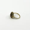 Side view of vintage 18ct gold ruby emerald and diamond cluster ring with raised open gallery setting