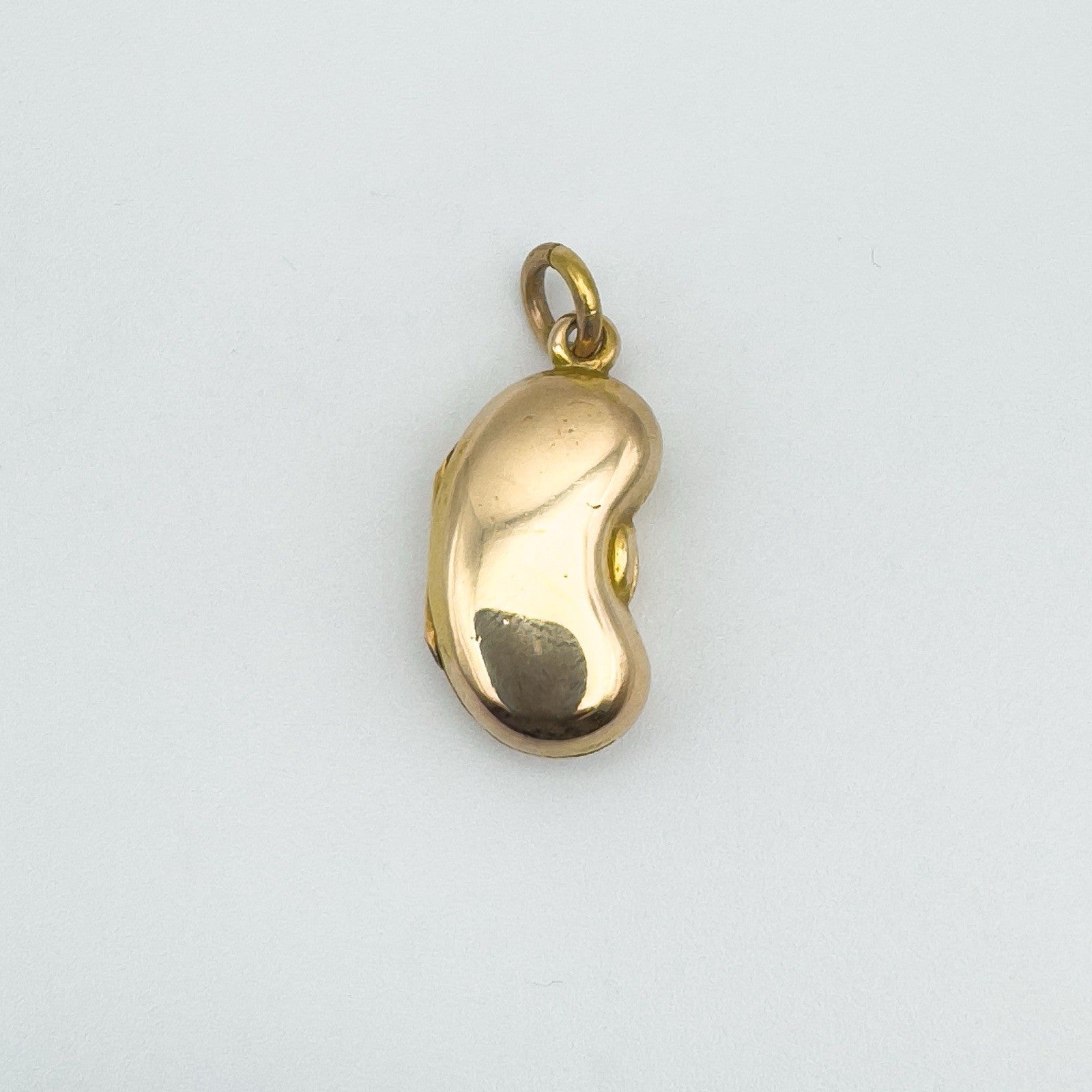 Preloved 18ct gold kidney bean locket pendant with smooth polished finish