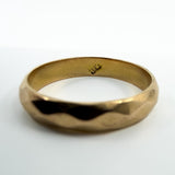 Close up of the 18k stamp inside the vintage 18ct rose gold faceted band ring.
