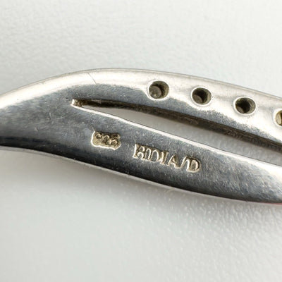 Close-up of 925 and HDIA/D hallmark on back of pendant