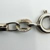 Close-up of the 925 stamp and import marks on a vintage sterling silver box chain necklace.