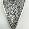 Close-up of 925 hallmark on back of silver engraved heart pendant