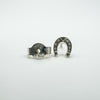Close-up of 925 stamp on butterfly back and horseshoe earring