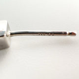 Macro close-up of the 925 hallmark and maker's mark on the earring post
