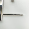 Close-up of earring post stamped 925 with infinity-style maker’s mark on sterling silver J earrings