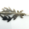 Close up of the 925 stamp on the back of the vintage sterling silver turquoise brooch.