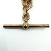 Close up of the 9c stamp on the T bar of an antique 9ct rose gold Albert chain