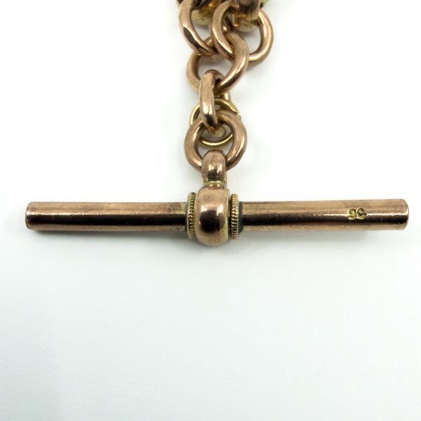Close up of the 9c stamp on the T bar of an antique 9ct rose gold Albert chain