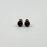 Vintage 9ct gold cultured black pearl stud earrings shown from the front with butterfly backs