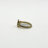 Side view of 9ct gold Irish Claddagh ring showing internal hallmarks and 375 stamp.
