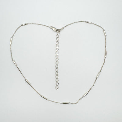 Full view of adjustable sterling silver curb and tubular chain necklace