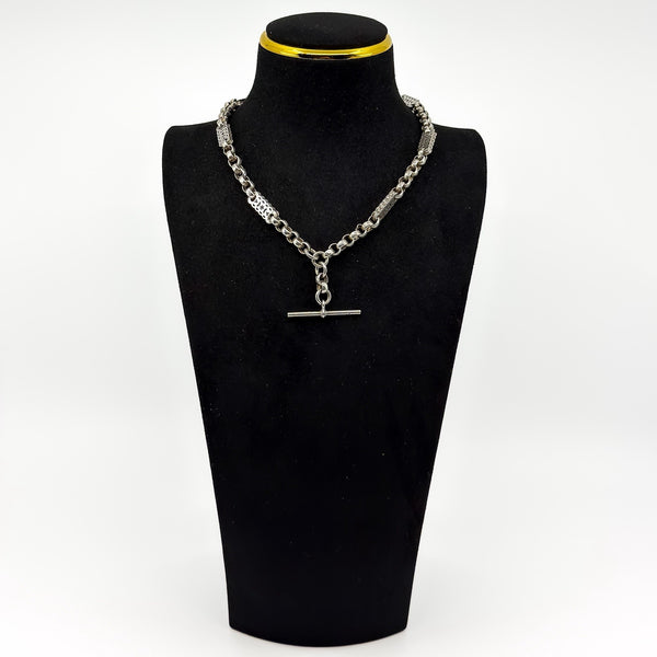 Antique Victorian sterling silver Albert chain worn as a short necklace on a black display bust