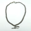 Full view of the antique sterling silver Albert chain with double dog clips, T-bar and additional links.