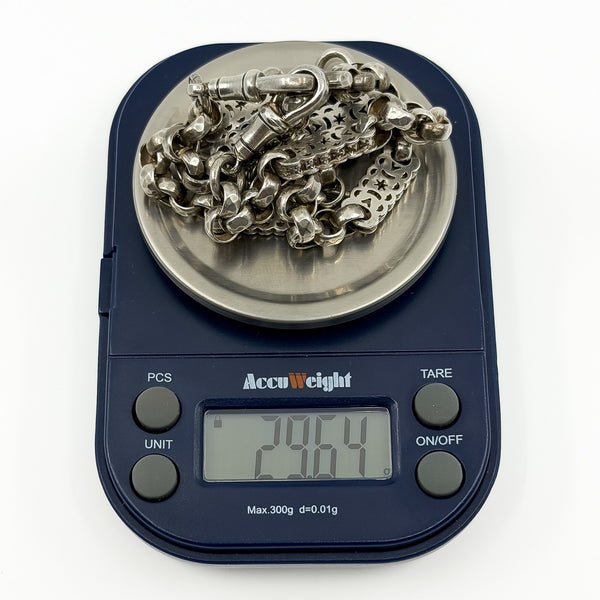 Antique Victorian sterling silver Albert chain on scales showing an approximate weight of 29.64 g