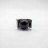 Close-up of amethyst ball set in modernist sterling silver ring
