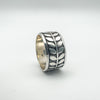 Sterling silver fidget-style ring with raised leaf engraving