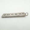 Angled photo highlighting texture and stamped silver marks