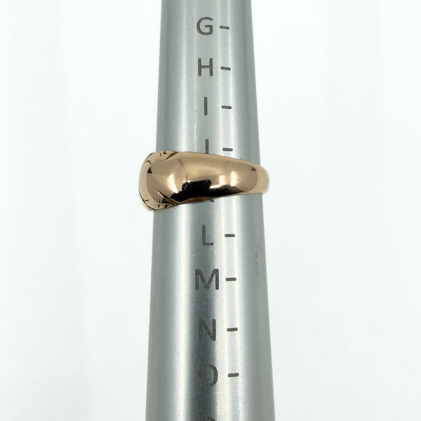 Side view of the antique 12ct rose gold band ring on a ring mandrel