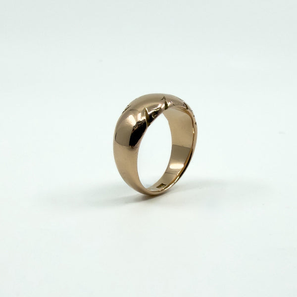 Antique 12ct rose gold band ring standing view, showing domed profile
