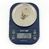 Antique rose gold rose-cut diamond solitaire ring shown on digital scales weighing approximately 2.98g.