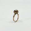 Angled profile of antique 14ct rose gold ring showing the raised diamond setting and decorative openwork.