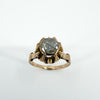 Close-up of antique 14ct rose gold ring with a natural rose-cut diamond in a six-prong setting.