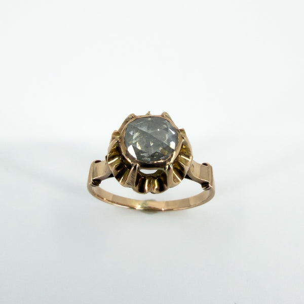 Close-up of antique 14ct rose gold ring with a natural rose-cut diamond in a six-prong setting.