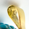 Macro view of the Victorian locket bail showing the crown and 18 gold marks inside the fitting.