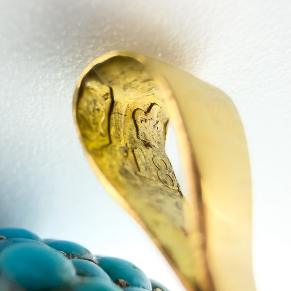 Macro view of the Victorian locket bail showing the crown and 18 gold marks inside the fitting.