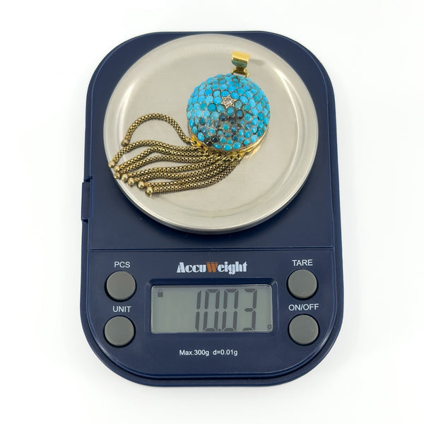 Victorian 18ct gold turquoise and rose-cut diamond tassel locket shown on scales weighing approximately 10.03g.