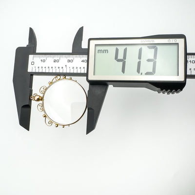 Measuring full length of locket pendant with calipers
