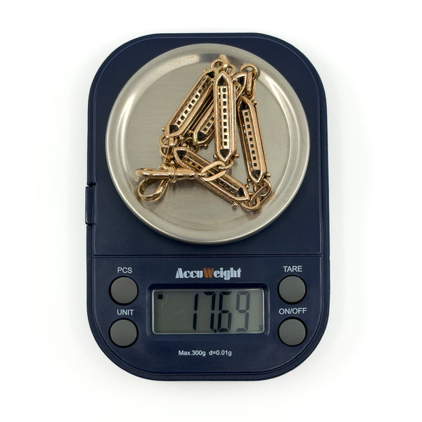 Antique 9ct rose gold fancy link bracelet shown on digital scales weighing 17.69g