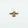 Side profile of an antique 9ct rose gold engraved cross pendant showing raised edge detail