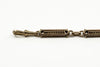Detailed view of the antique 9ct rose gold bracelet link pattern and warm gold tone