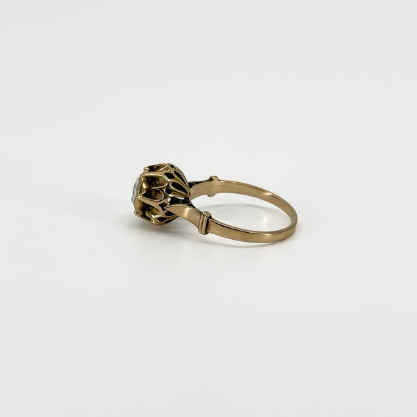 Side detail of the antique rose gold ring showing the decorative openwork around the rose-cut diamond setting.
