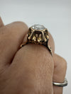Close-up of the antique rose gold ring worn on the finger, showing the rose-cut diamond and decorative setting.