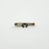 Reverse of antique 9ct gold horseshoe bar brooch showing pin and hook fitting