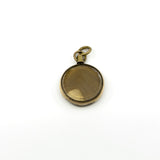 Antique rolled gold double sided glass locket showing the original lock of blonde hair inside