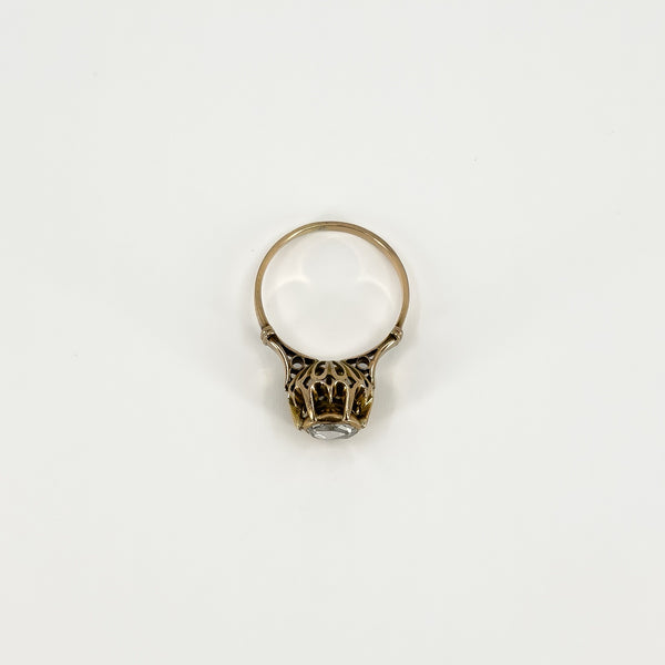 View from above of the antique rose gold ring showing the decorative setting beneath the rose-cut diamond.