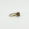 Side view of antique 14ct rose gold ring showing the decorative setting, shoulder detail and rose-cut diamond.