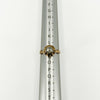 Antique 14ct rose gold rose-cut diamond ring shown on a ring sizing mandrel at UK Size M.