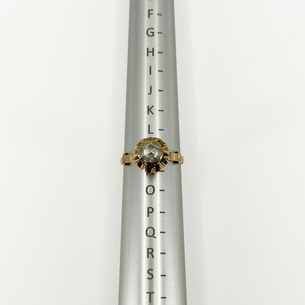 Antique 14ct rose gold rose-cut diamond ring shown on a ring sizing mandrel at UK Size M.