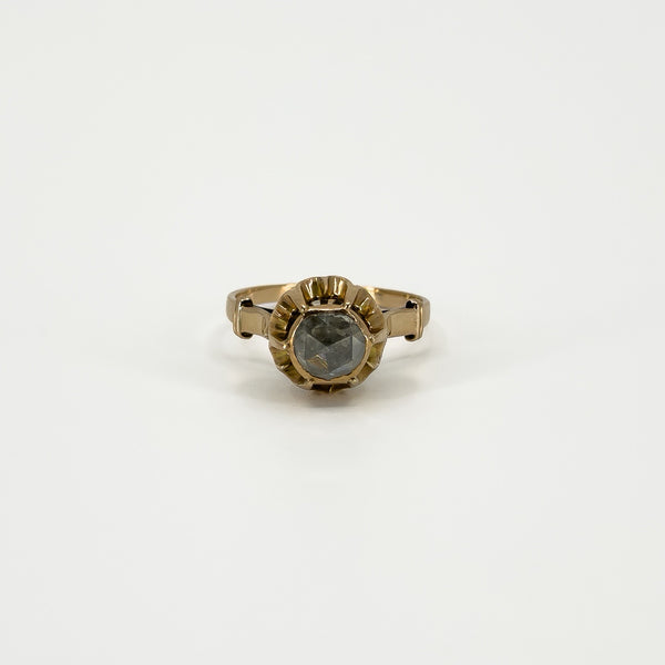 Front view of antique 14ct rose gold solitaire ring showing the rose-cut diamond and decorative setting.