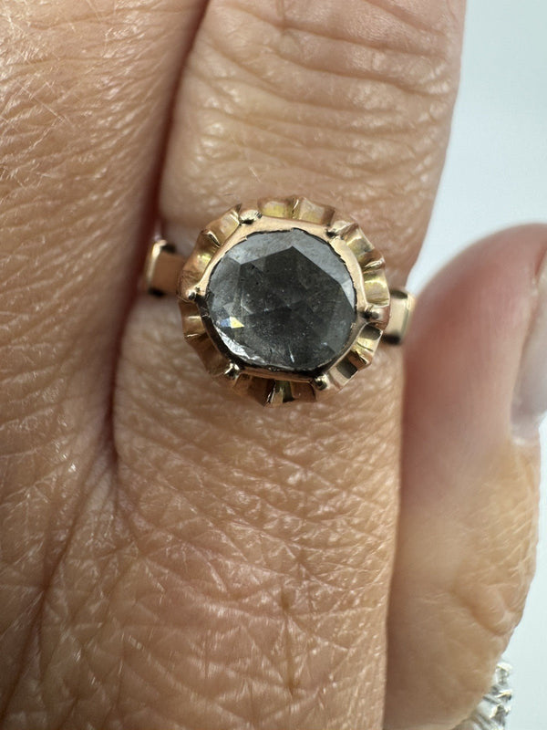 Close-up of antique 14ct rose gold ring worn on the hand, showing the natural rose-cut diamond and six-prong setting.